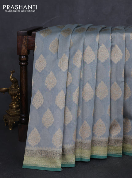 Banarasi silk cotton saree grey and green shade with zari woven buttas and woven border