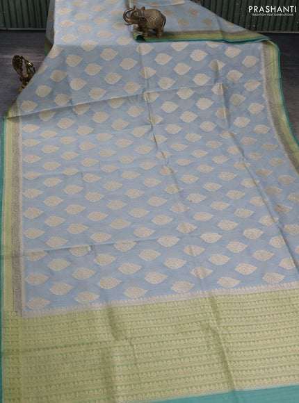 Banarasi silk cotton saree grey and green shade with zari woven buttas and woven border