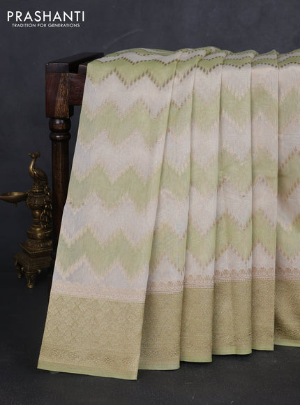 Banarasi silk cotton saree cream and pista green with allover zari weaves and zari woven border