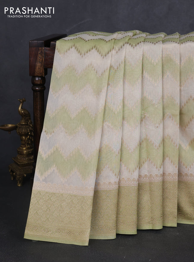 Banarasi silk cotton saree cream and pista green with allover zari weaves and zari woven border