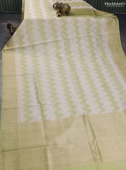 Banarasi silk cotton saree cream and pista green with allover zari weaves and zari woven border