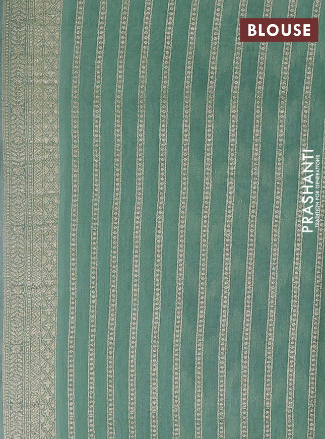 Banarasi silk cotton saree pastel green and green with allover zari weaves and zari woven border