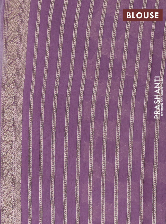 Banarasi silk cotton saree pastel purple with allover zari weaves and zari woven border