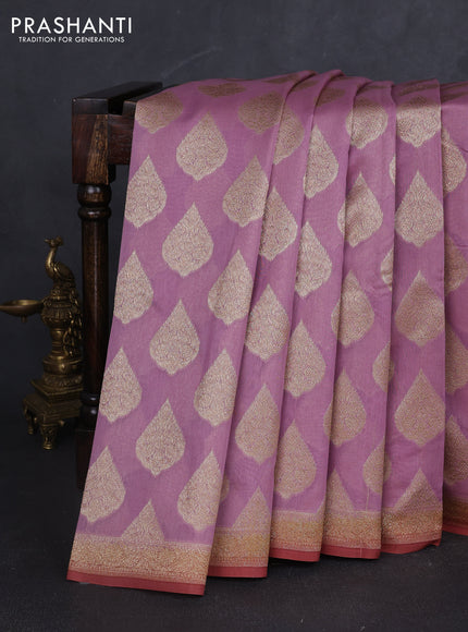 Banarasi silk cotton saree pastel pink and rust shade with allover zari woven buttas and zari woven border