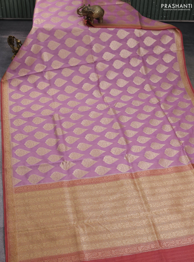 Banarasi silk cotton saree pastel pink and rust shade with allover zari woven buttas and zari woven border