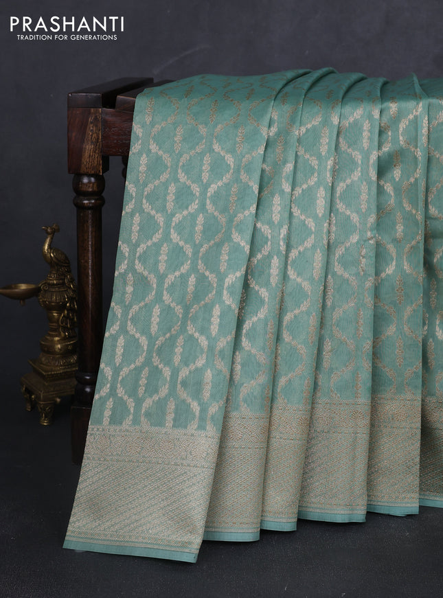 Banarasi silk cotton saree pastel green with allover zari weaves and zari woven border