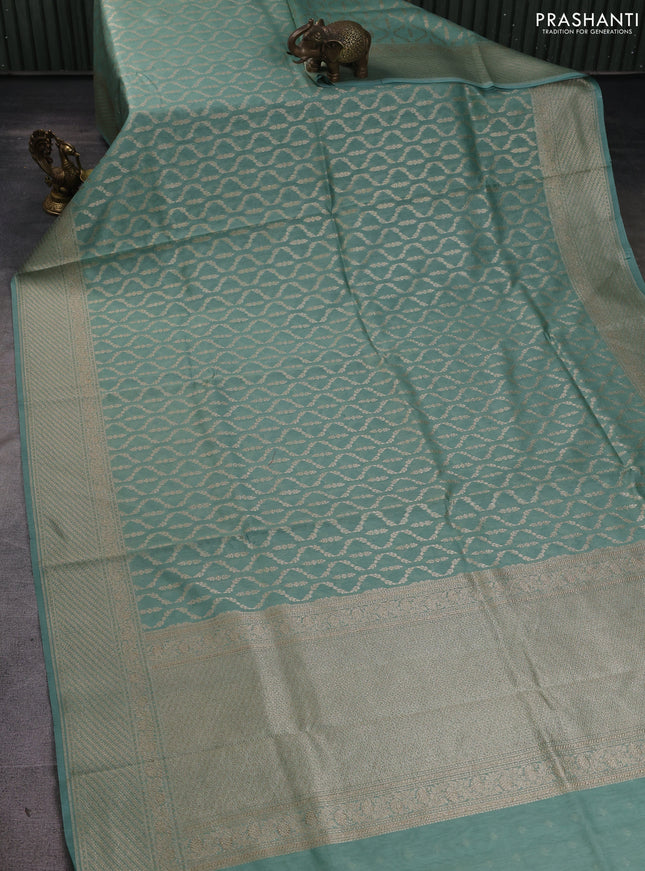 Banarasi silk cotton saree pastel green with allover zari weaves and zari woven border