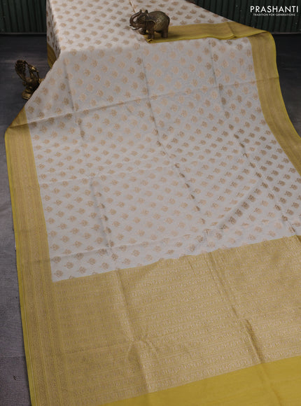 Banarasi silk cotton saree cream and pale yellow with allover thread & zari woven buttas and woven border