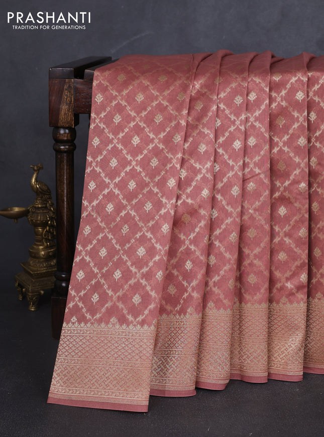 Banarasi silk cotton saree peach shade with allover zari woven buttas and zari woven border