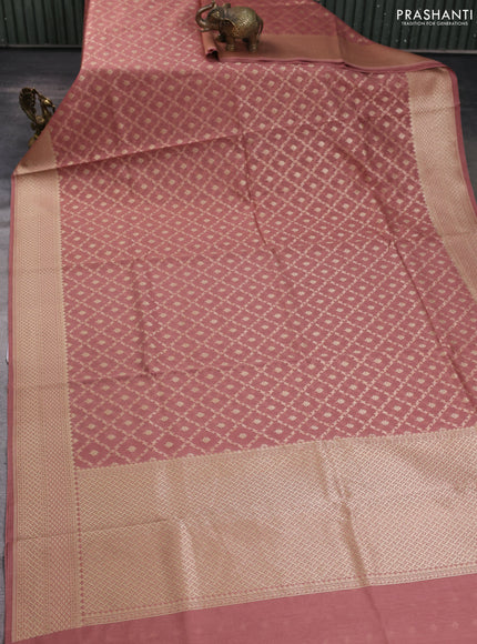 Banarasi silk cotton saree peach shade with allover zari woven buttas and zari woven border