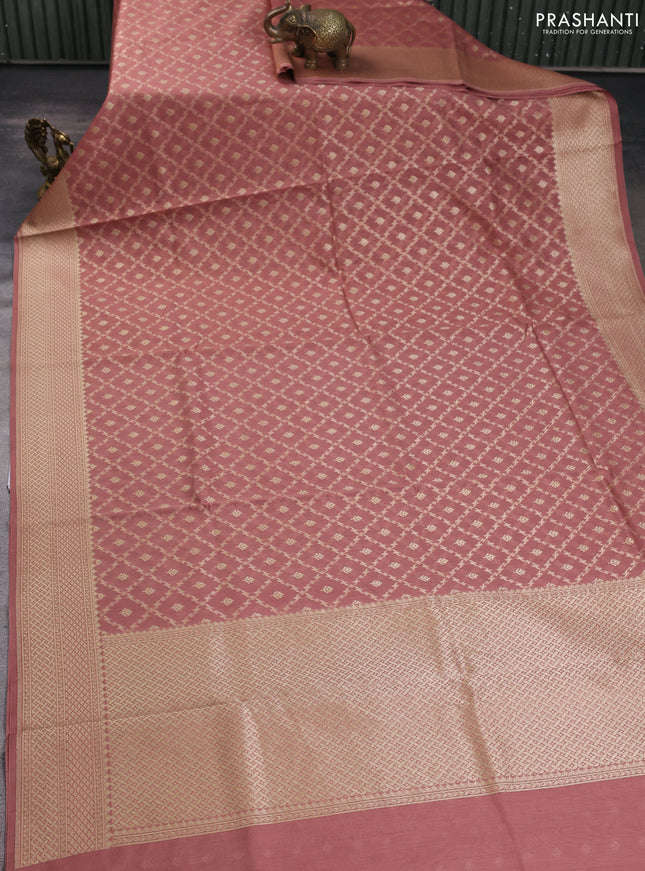 Banarasi silk cotton saree peach shade with allover zari woven buttas and zari woven border