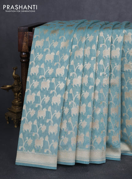 Banarasi silk cotton saree pastel blue with allover pichwai zari woven butta weaves and zari woven border