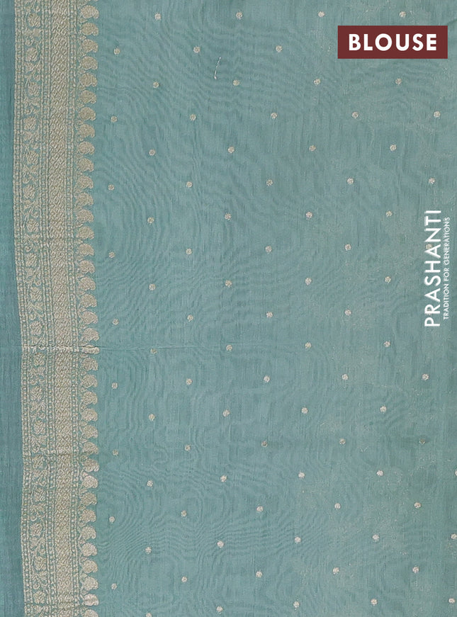Banarasi silk cotton saree cream and pastel green shade with allover floral zari weaves and zari woven border
