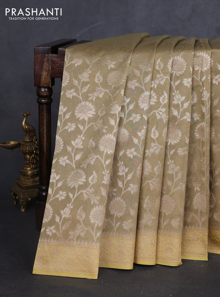 Banarasi silk cotton saree beige and yellow with allover zari woven buttas and zari woven border