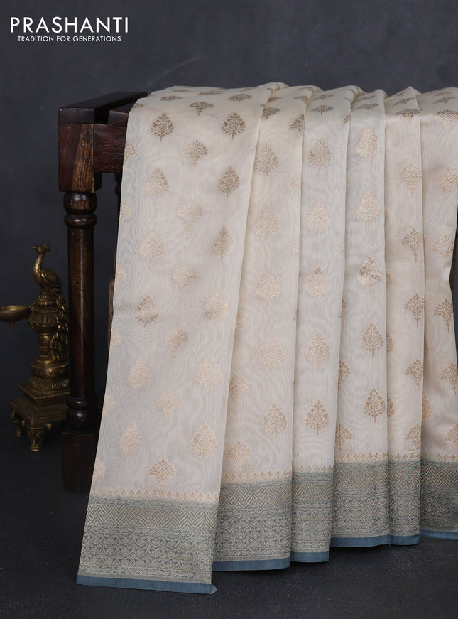 Banarasi silk cotton saree cream and bluish grey with allover zari woven buttas and zari woven border