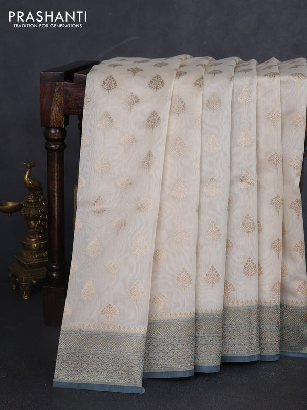 Banarasi silk cotton saree cream and bluish grey with allover zari woven buttas and zari woven border