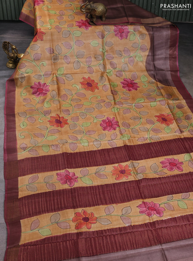 Pure tussar silk saree sandal and mauve pink with allover hand painted prints and zari woven border