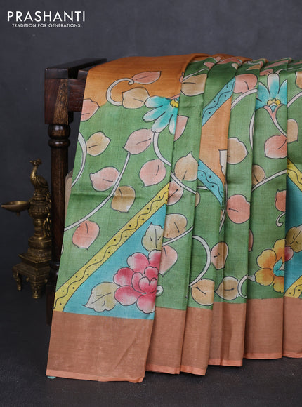 Pure tussar silk saree pastel green and peach shade with allover hand painted prints and zari woven border
