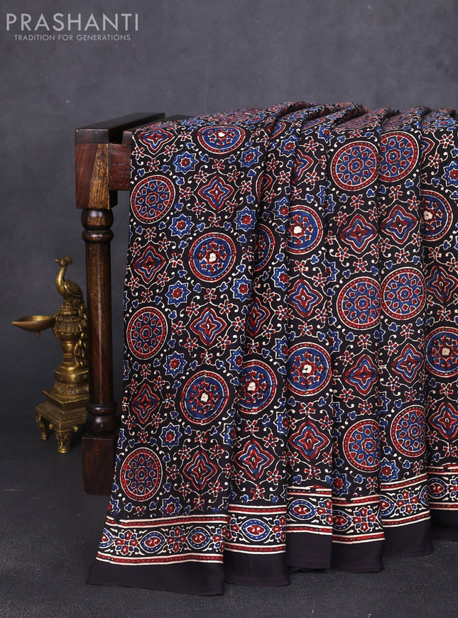 Modal silk saree black with allover ajrak prints and zari woven pallu