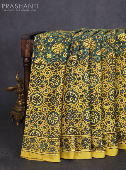 Modal silk saree yellow and mehendi green with allover ajrak prints and zari woven pallu