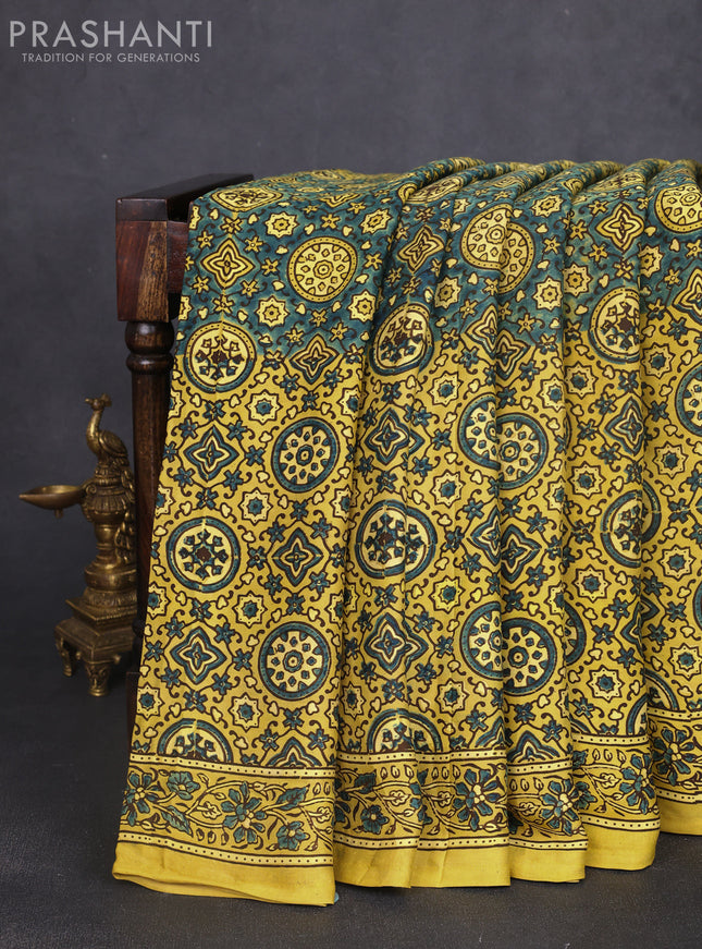 Modal silk saree yellow and mehendi green with allover ajrak prints and zari woven pallu