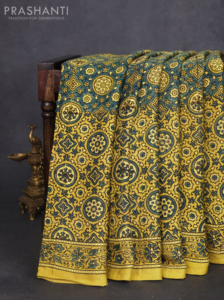 Modal silk saree yellow and mehendi green with allover ajrak prints and zari woven pallu