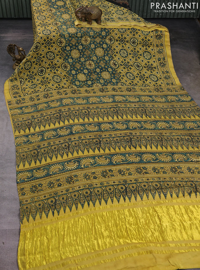 Modal silk saree yellow and mehendi green with allover ajrak prints and zari woven pallu