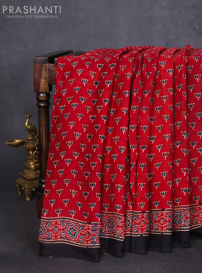 Modal silk saree rust shade and black with allover ajrak butta prints and zari woven pallu