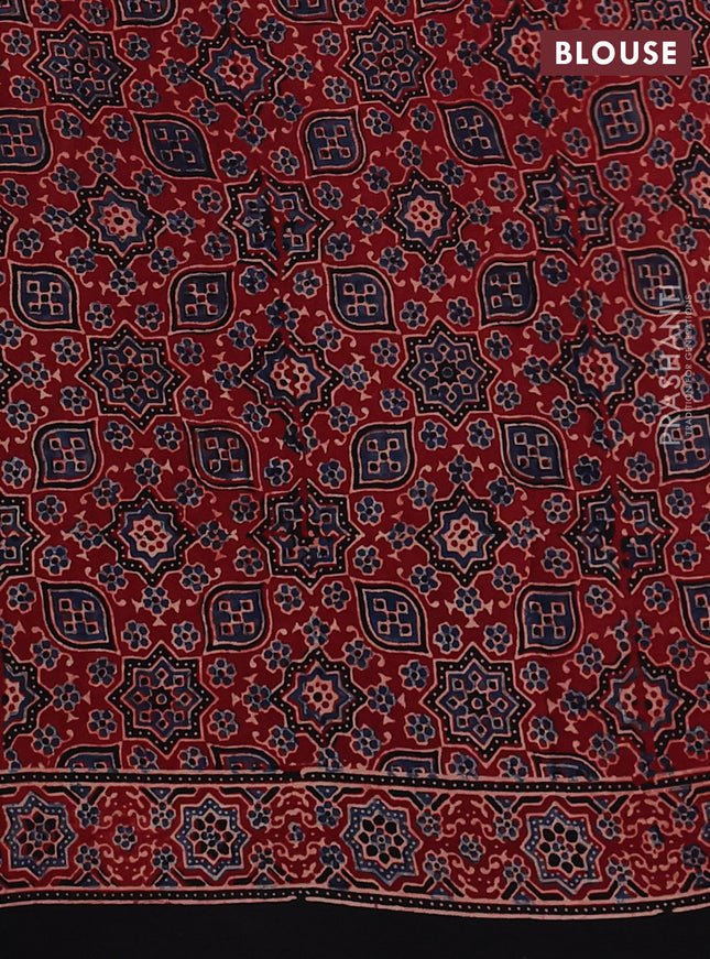Modal silk saree rust shade and black with allover ajrak butta prints and zari woven pallu