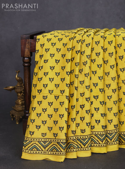 Modal silk saree yellow with allover ajrak butta prints and zari woven pallu