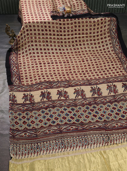 Modal silk saree cream and black with allover ajrak butta prints and zari woven pallu