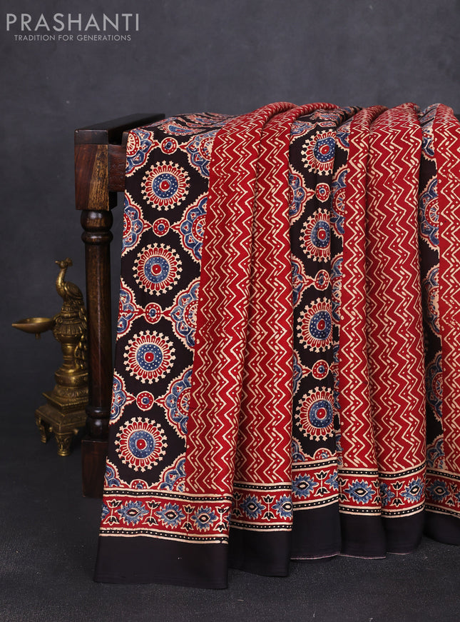 Modal silk saree maroon and black with allover ajrak prints and zari woven pallu