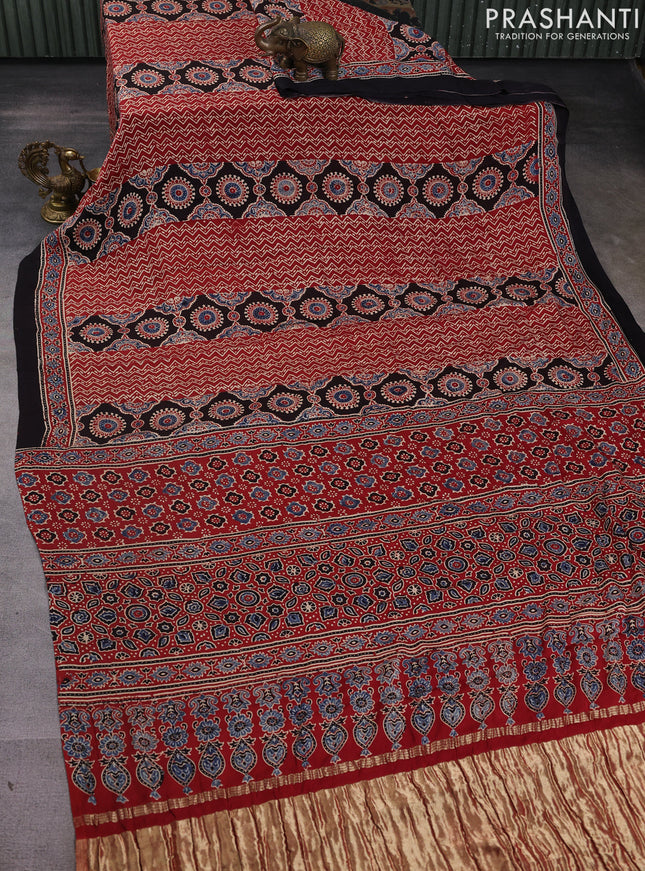 Modal silk saree maroon and black with allover ajrak prints and zari woven pallu
