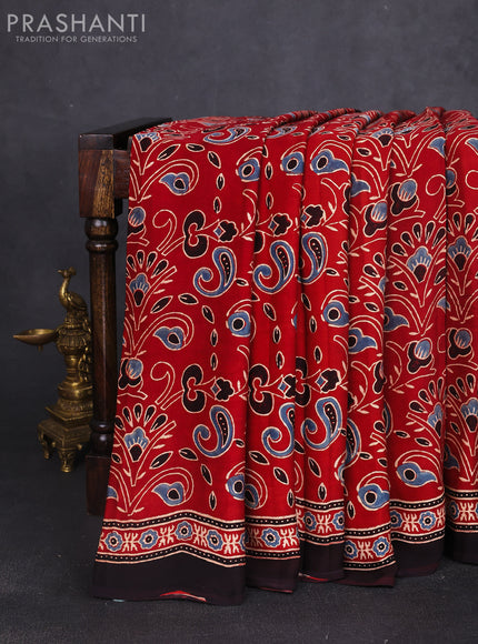 Modal silk saree maroon and black with allover ajrak prints and zari woven pallu
