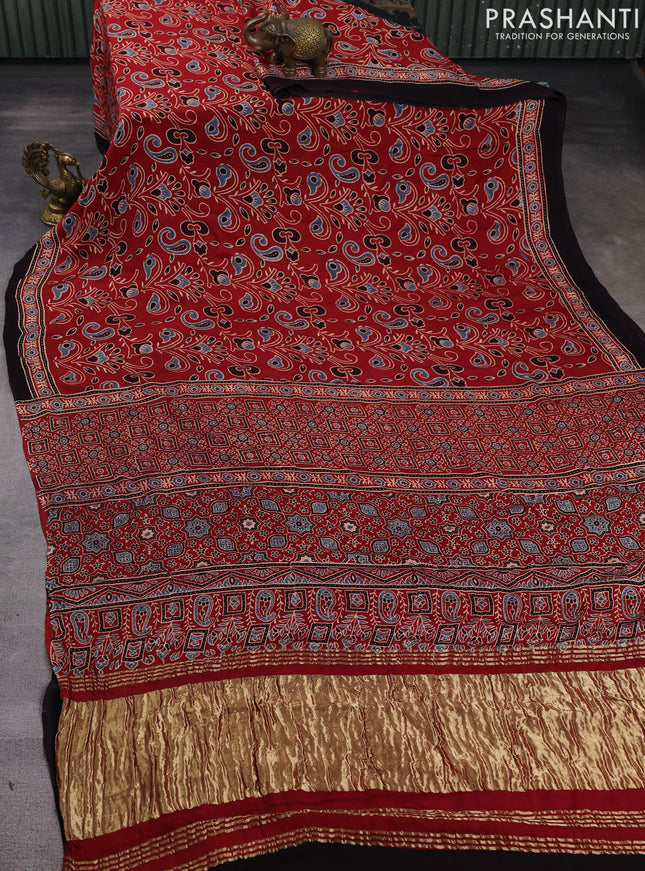 Modal silk saree maroon and black with allover ajrak prints and zari woven pallu