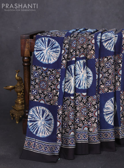 Modal silk saree indigo blue and black with allover ajrak butta prints and zari woven pallu