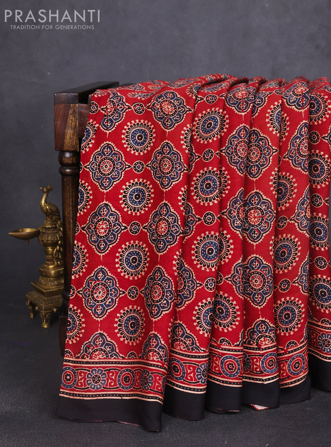 Modal silk saree maroon and black with allover ajrak prints and zari woven pallu