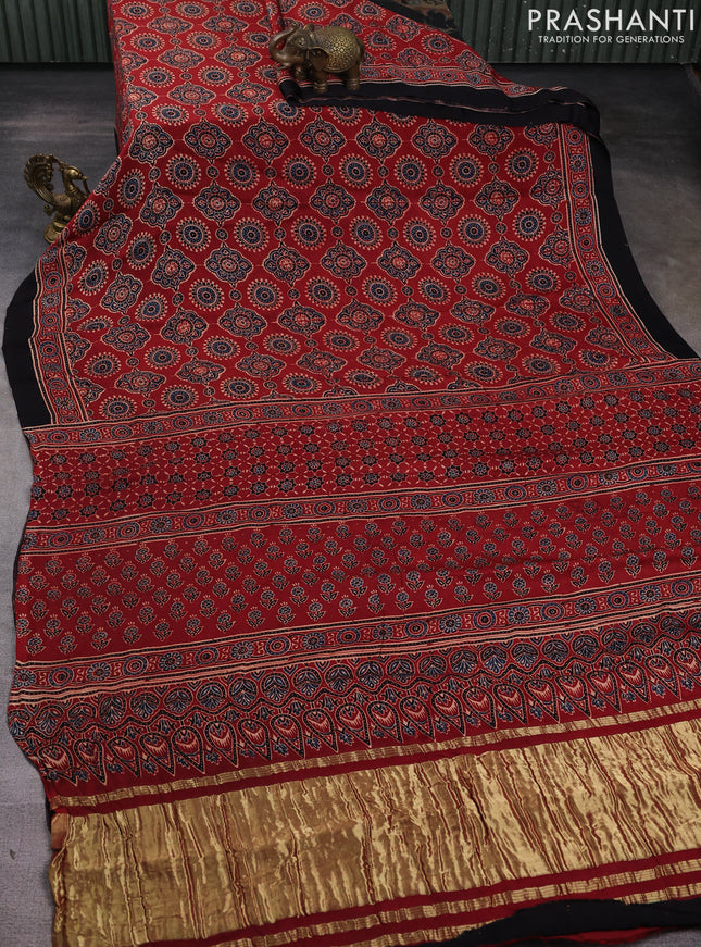 Modal silk saree maroon and black with allover ajrak prints and zari woven pallu