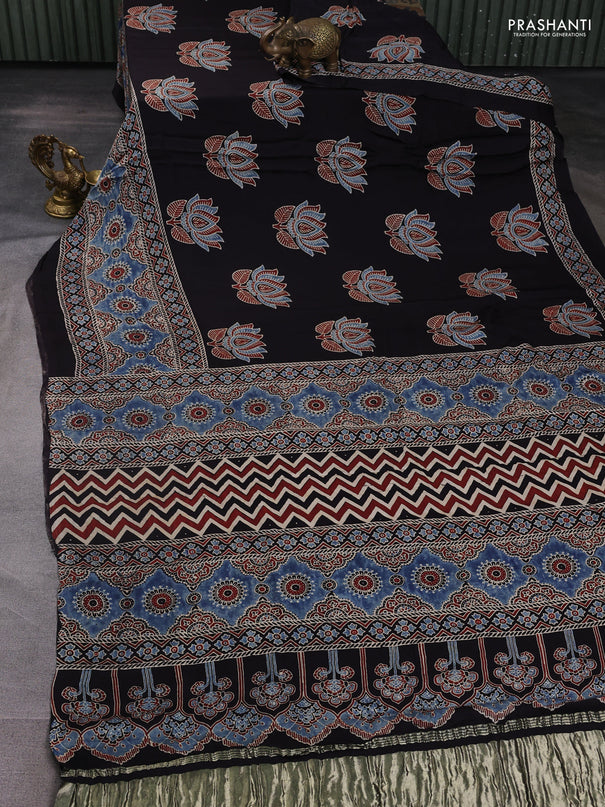 Modal silk saree black and indigo blue with allover ajrak prints and zari woven pallu
