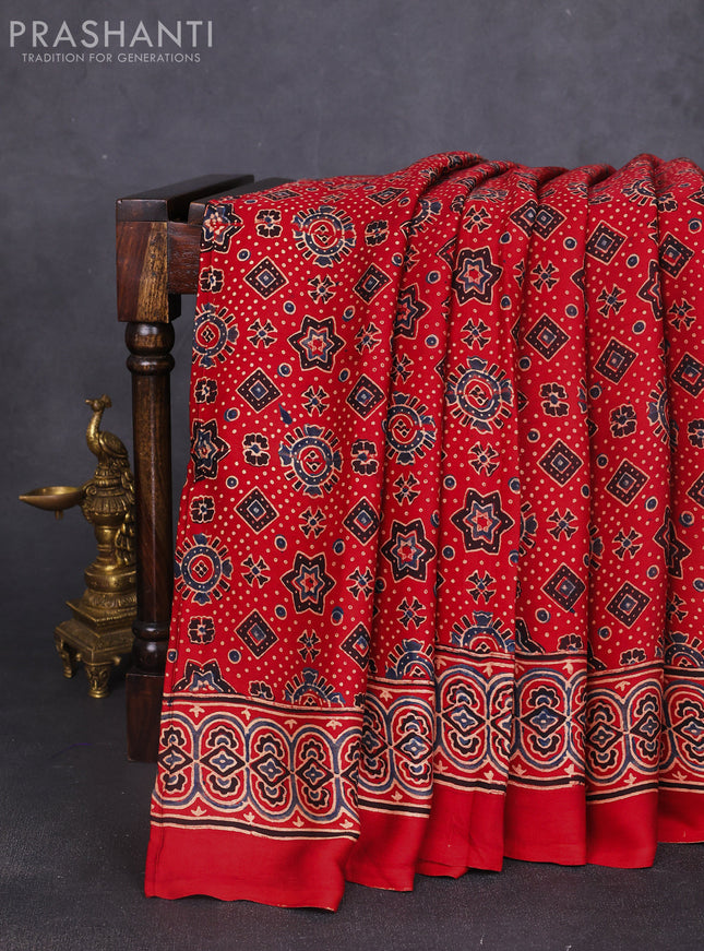Modal silk saree maroon with allover ajrak prints and zari woven pallu