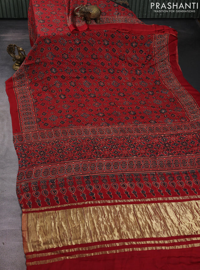 Modal silk saree maroon with allover ajrak prints and zari woven pallu