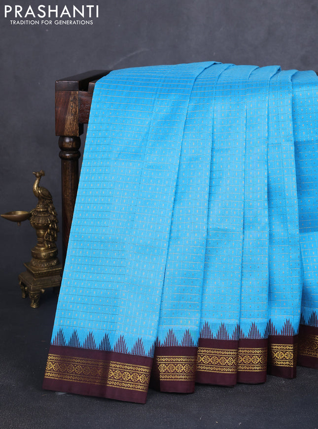 Kuppadam silk cotton saree cs blue and coffee brown with allover zari checks & lakshadeepam weaves and temple design zari woven border