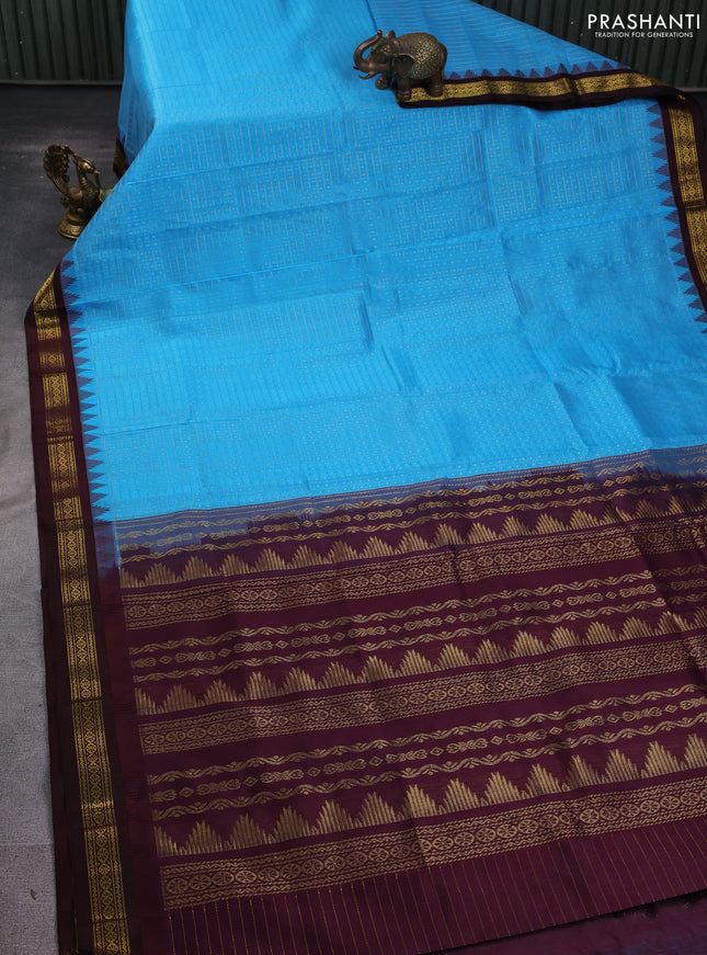 Kuppadam silk cotton saree cs blue and coffee brown with allover zari checks & lakshadeepam weaves and temple design zari woven border