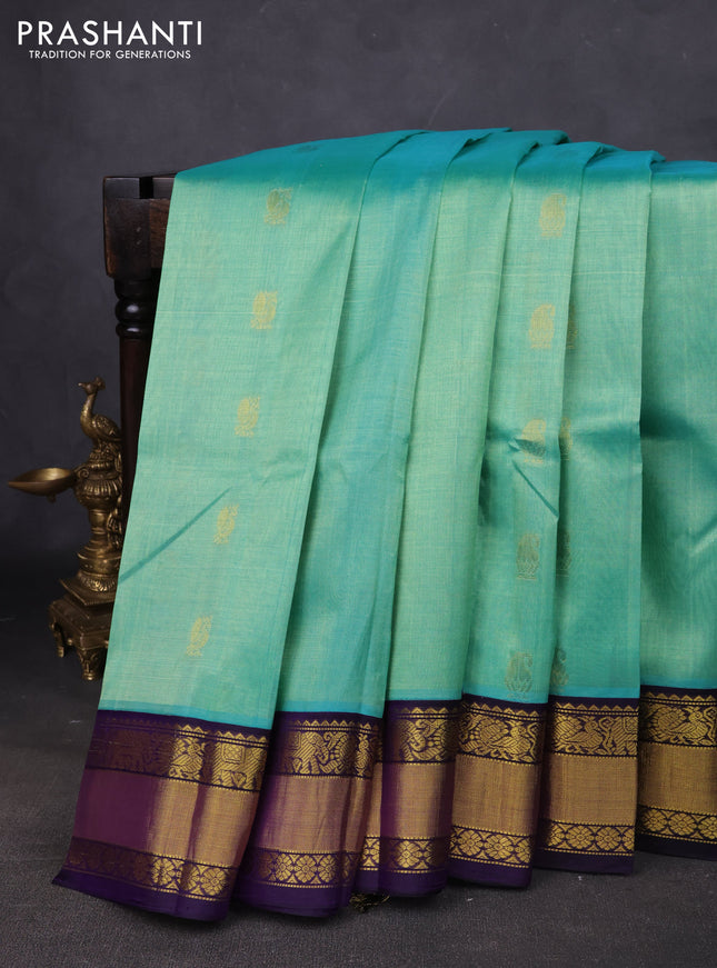 Kuppadam silk cotton saree teal shade and navy blue with annam zari woven buttas and zari woven korvai border
