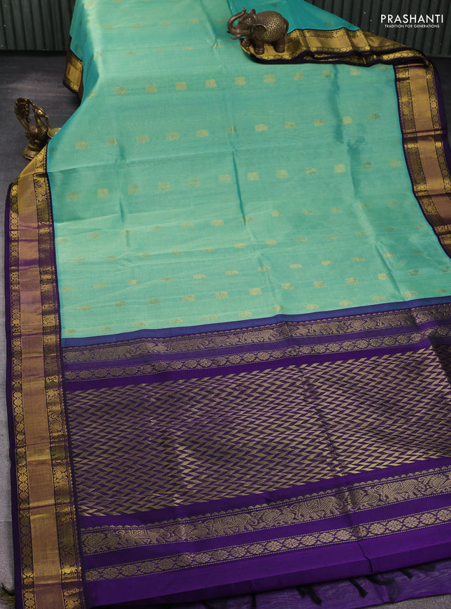 Kuppadam silk cotton saree teal shade and navy blue with annam zari woven buttas and zari woven korvai border