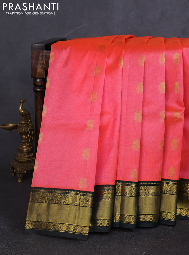 Kuppadam silk cotton saree peach pink and bottle green with annam zari woven buttas and zari woven korvai border
