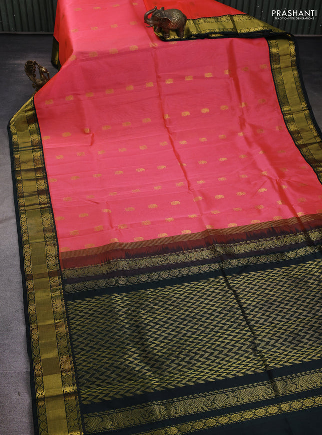 Kuppadam silk cotton saree peach pink and bottle green with annam zari woven buttas and zari woven korvai border