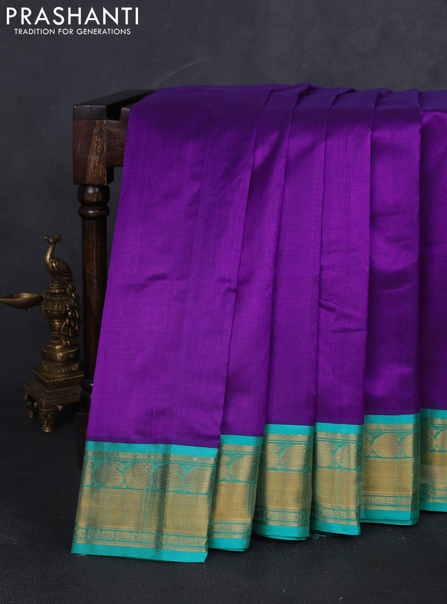 Kuppadam silk cotton saree purple and teal blue with plain body and paisley zari woven border