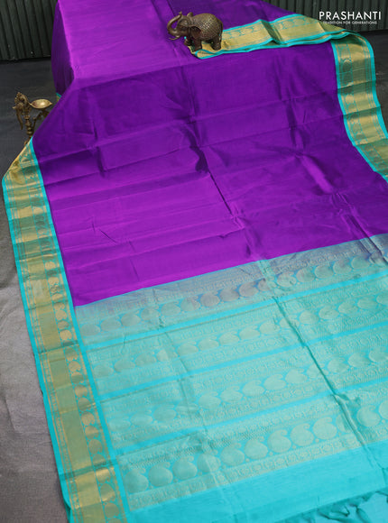 Kuppadam silk cotton saree purple and teal blue with plain body and paisley zari woven border