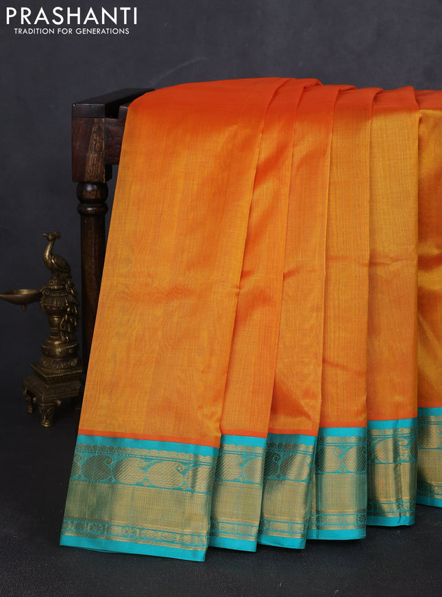 Kuppadam silk cotton saree mango yellow and teal blue with plain body and paisley zari woven border